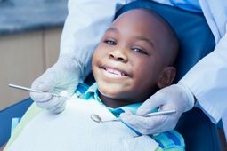 Boy smiling having dental checkup
